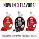 Three bottles of Wholesome Yum zero sugar syrup in strawberry, blueberry, and raspberry flavors are displayed with fresh berries, highlighting their low calorie and carb content.